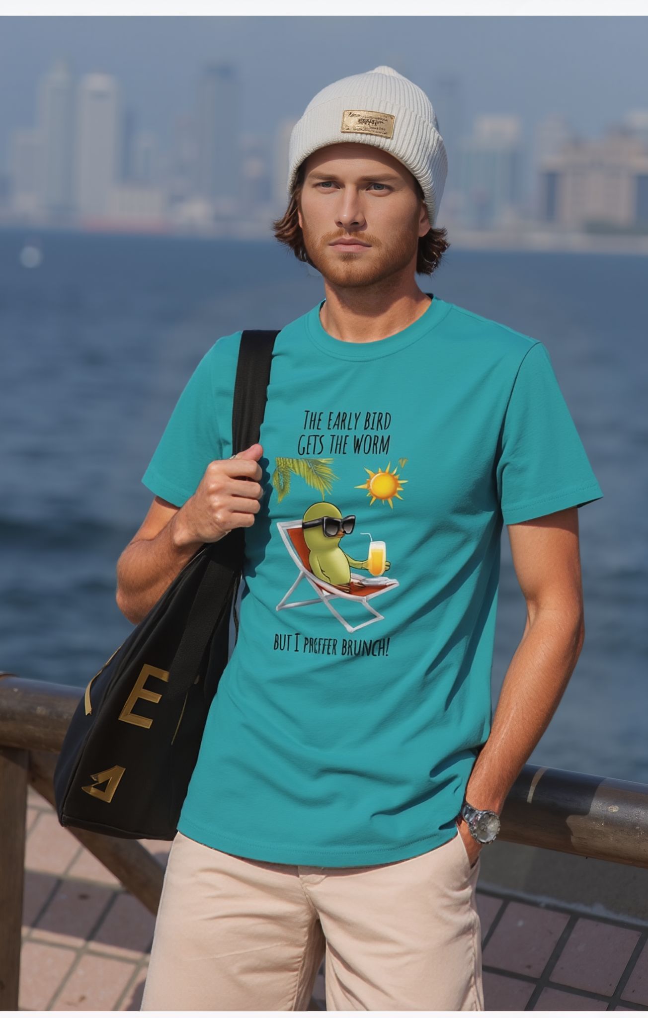 Man wearing 'prefer brunch' t-shirt by the water.