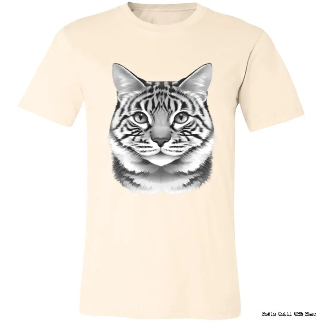 A beige t-shirt featuring a large, realistic black and white illustration of a tabby cat’s face centered on the chest. The cat has distinct stripes, rounded eyes, and a calm expression. The background and sleeves of the shirt are plain.