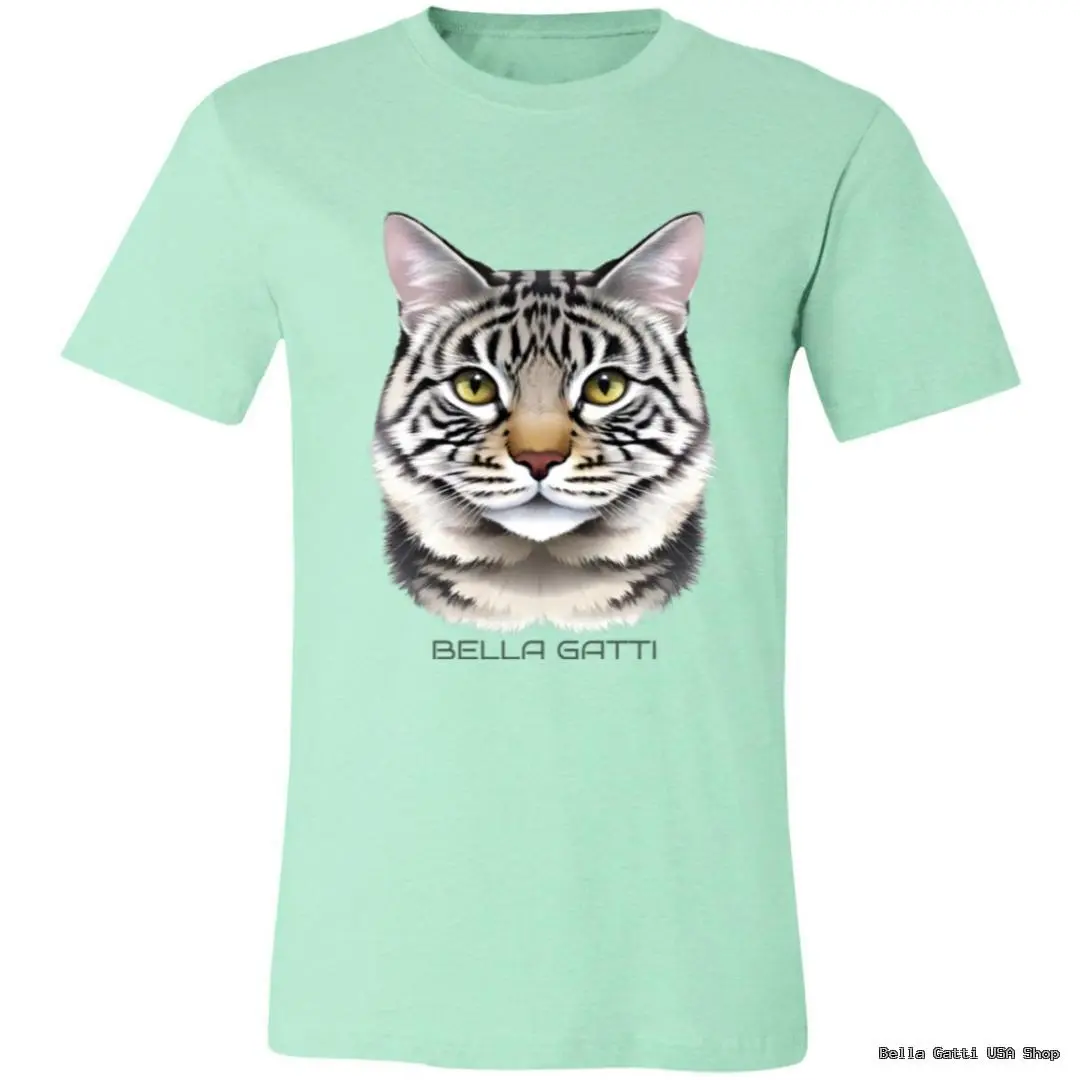 A mint green T-shirt features a realistic illustration of a gray tabby cat’s face. Below the cat’s head, the words “BELLA GATTI” are printed in all caps. The image is centered on the shirt’s front.