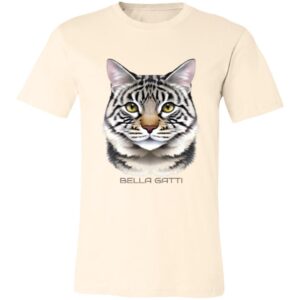 A cream-colored T-shirt featuring a realistic, detailed illustration of a tabby cats face with green eyes and black stripes. Below the cat, the text BELLA GATTI is printed in uppercase letters. The T-shirt is displayed on a plain background.