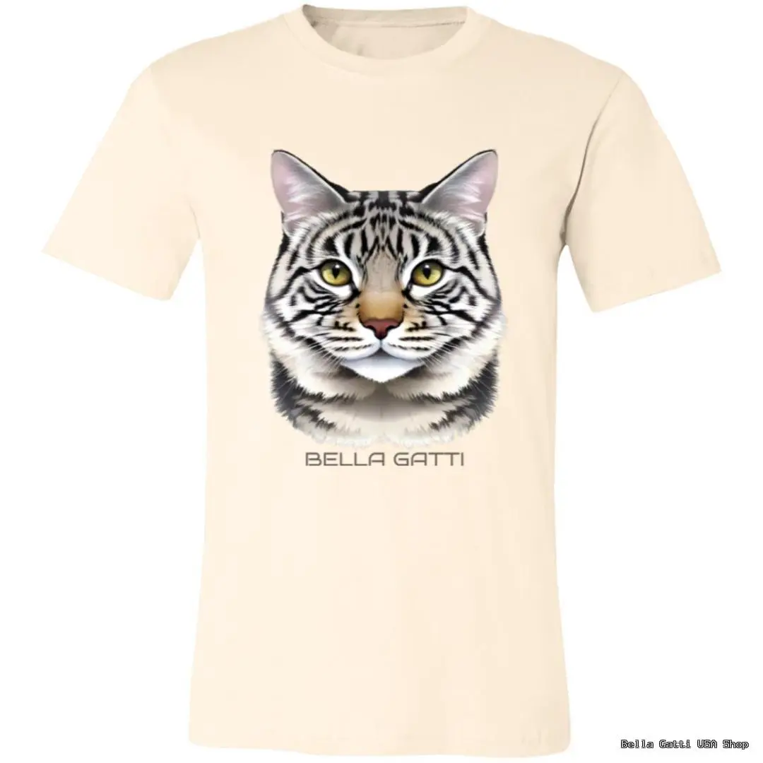 A cream-colored T-shirt featuring a realistic, detailed illustration of a tabby cats face with green eyes and black stripes. Below the cat, the text BELLA GATTI is printed in uppercase letters. The T-shirt is displayed on a plain background.