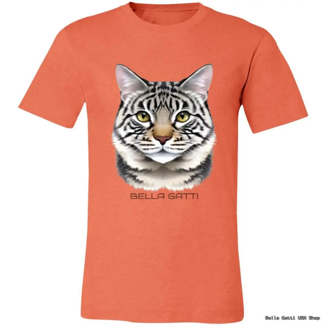 An orange t-shirt features a realistic illustration of a gray tabby cats face with green eyes. Below the cats head, the text BELLA GATTI is printed in uppercase letters. The design stands out against the plain background of the shirt.