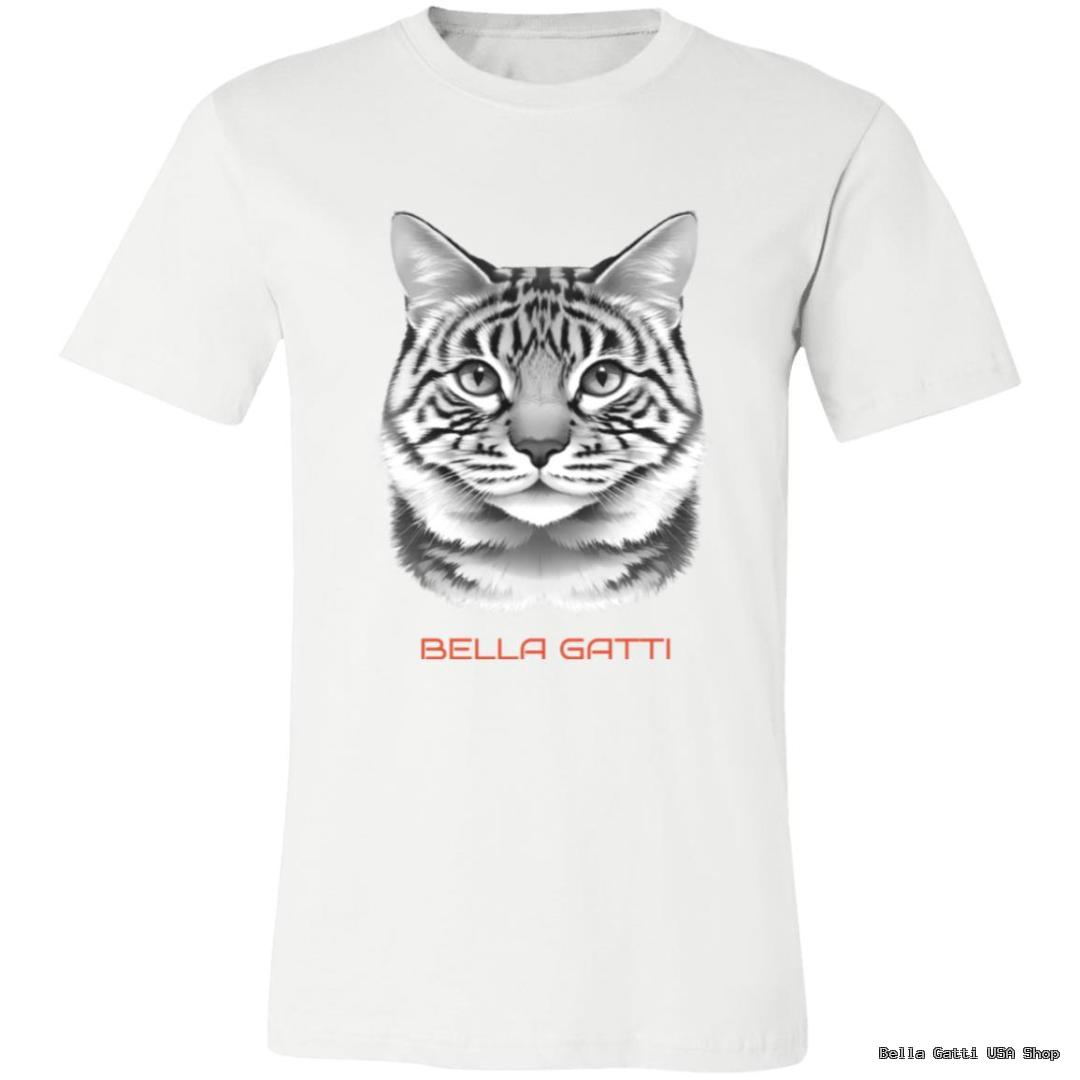 A white T-shirt features a detailed, realistic black-and-gray cat face illustration centered on the chest. Below the cat’s face, the words “BELLA GATTI” are written in bold, orange capital letters.