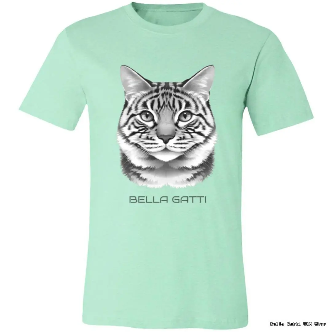 Light green T-shirt with a realistic black and white illustration of a tabby cat’s face centered on the chest. Below the cat image, the text “BELLA GATTI” is printed in uppercase letters. The T-shirt is displayed on a plain background.