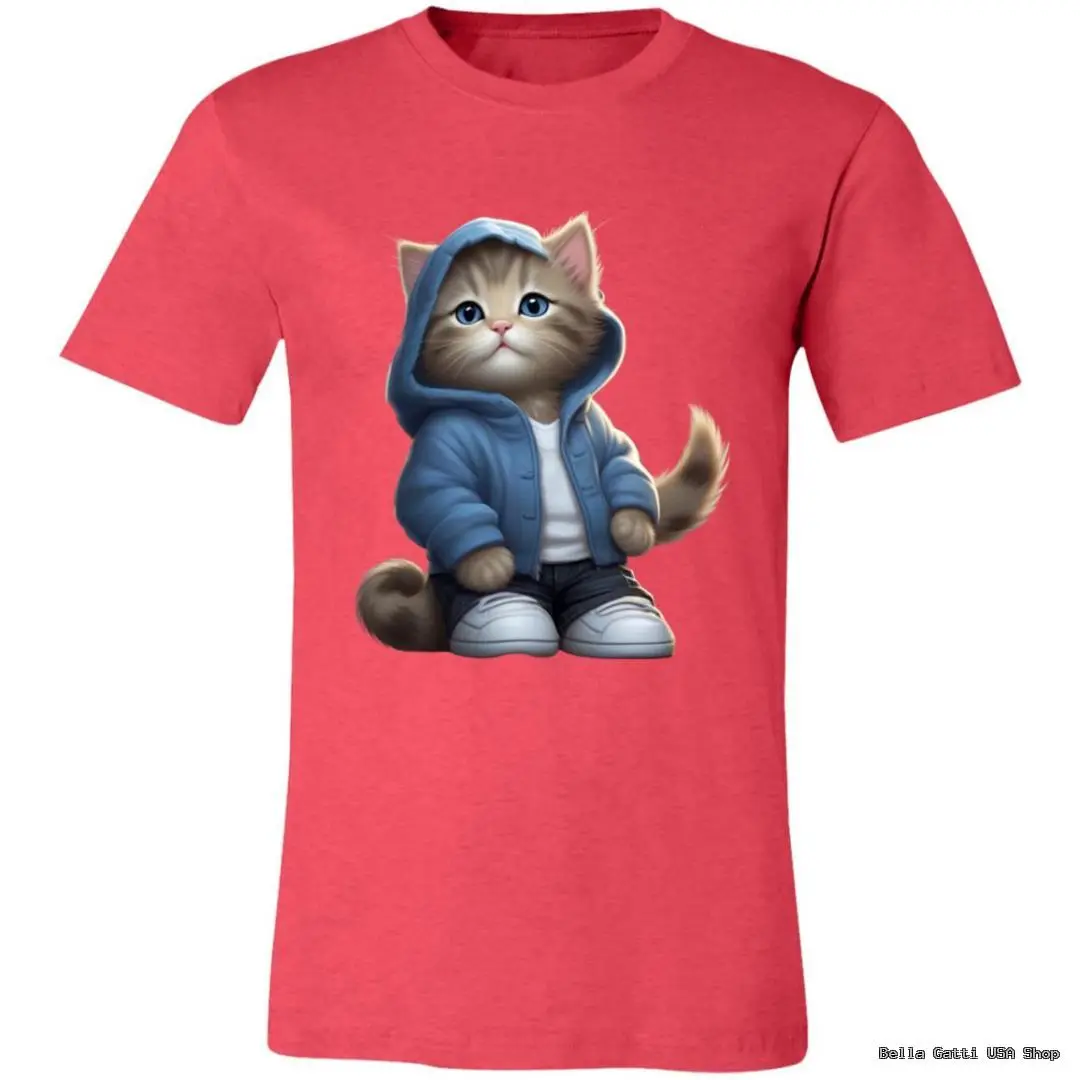 A pink T-shirt features a graphic of a cute, cartoon-style cat standing upright. The cat wears a blue hoodie, white shirt, dark pants, and white sneakers, with a sweet, wide-eyed expression and a fluffy tail curled to the side.