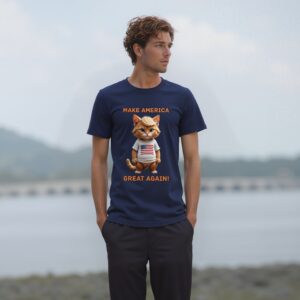 Man wearing political cat T-shirt by lake.