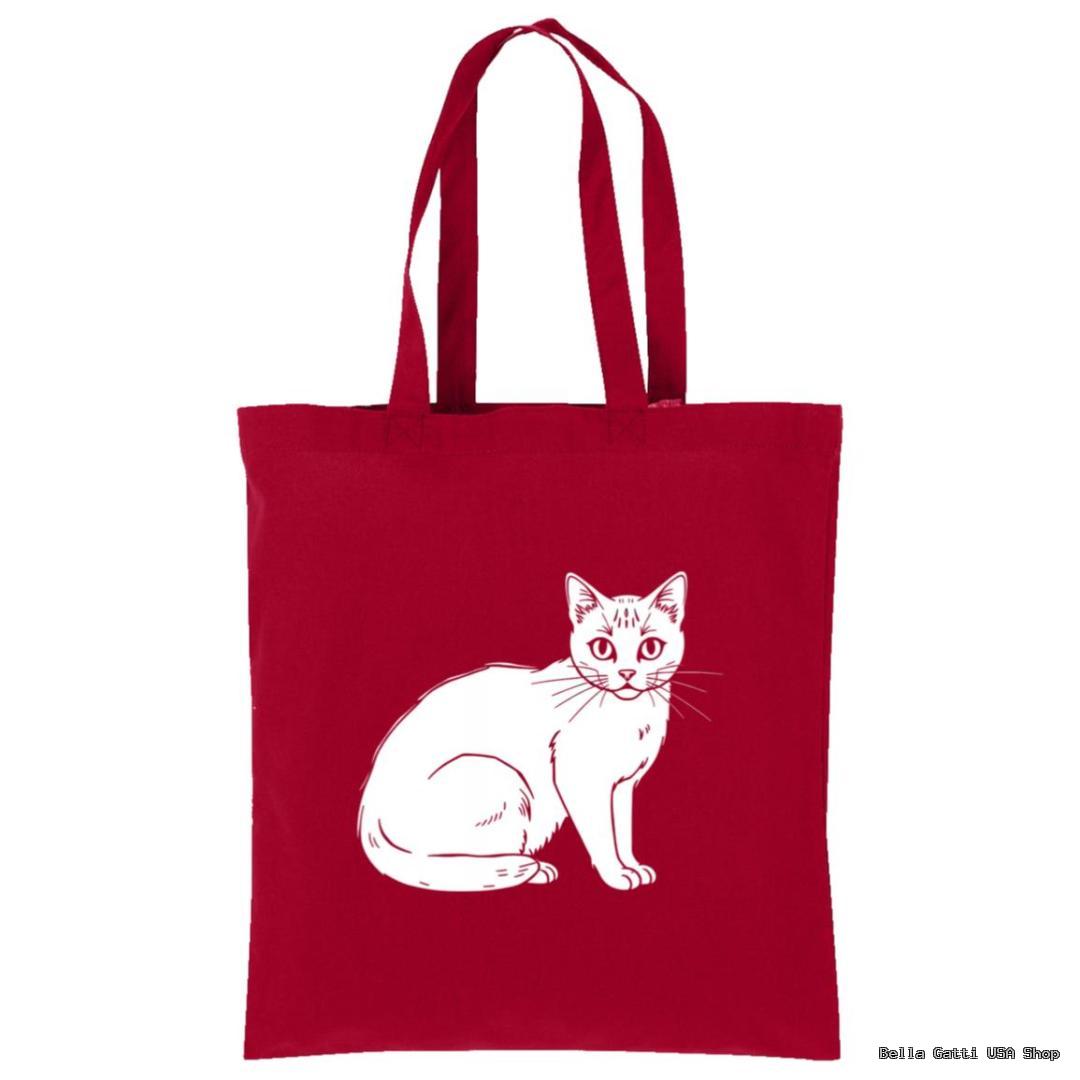A red tote bag with two handles features a simple white line drawing of a sitting cat in the center. The cat faces forward with its tail curled around its body. The background is plain white.