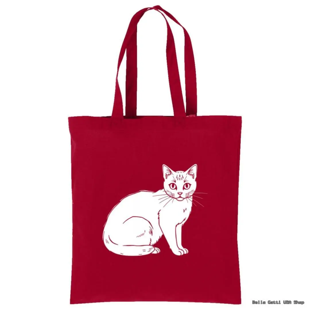 A red tote bag with two handles features a simple white line drawing of a sitting cat in the center. The cat faces forward with its tail curled around its body. The background is plain white.