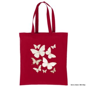 A red tote bag with two handles featuring a design of eight white and gold butterflies of various sizes grouped together in the center. The background is plain, highlighting the butterfly illustration.