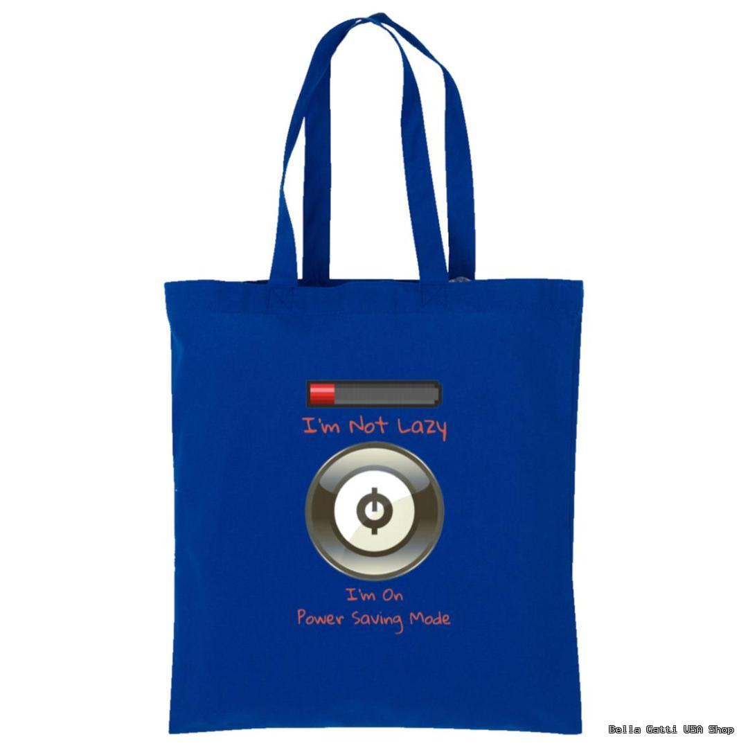 A blue tote bag with an illustration of a power button and a low battery icon above it. Surrounding the power button, the text reads, Im Not Lazy, Im On Power Saving Mode in playful fonts and orange and white colors.