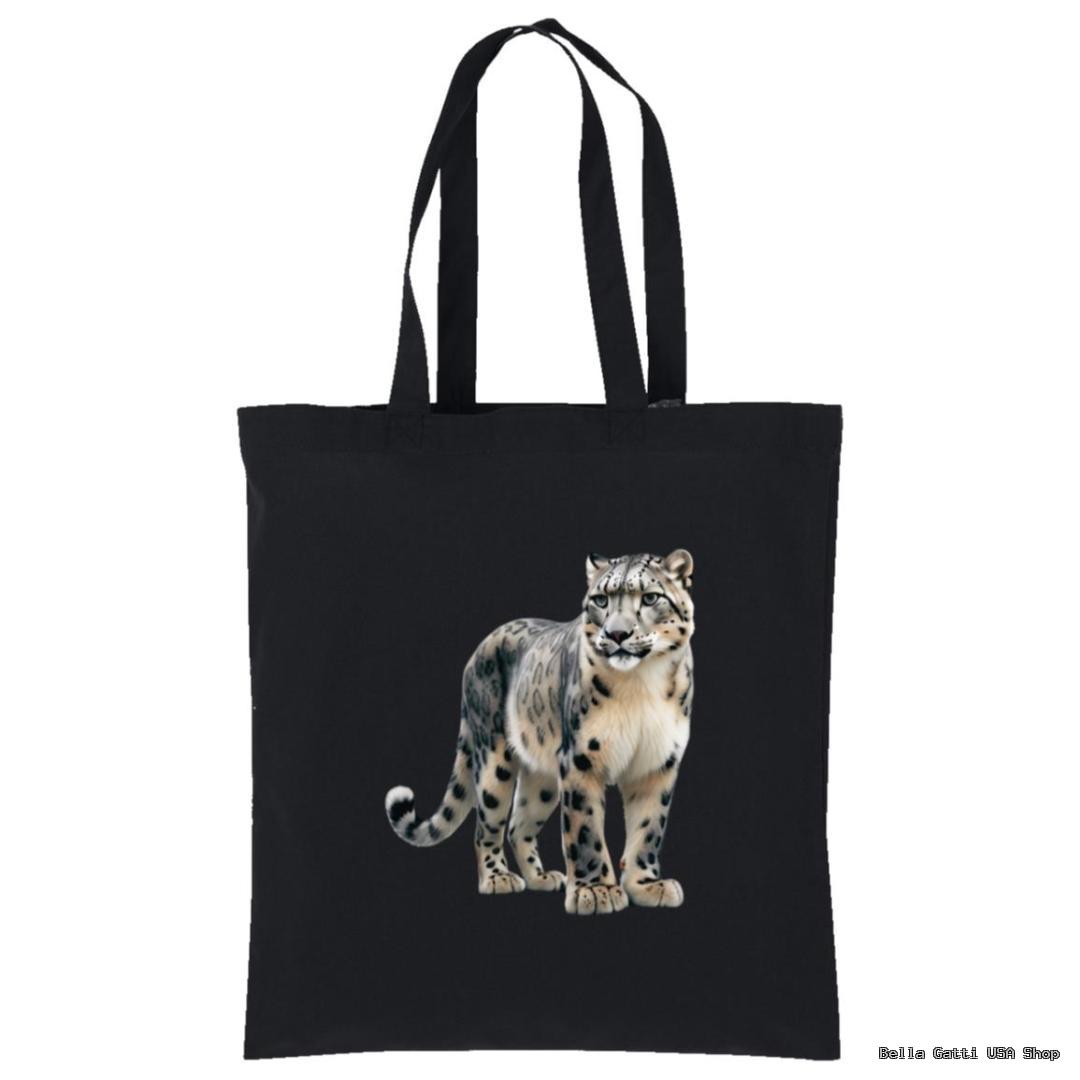 A black tote bag with long handles features a detailed illustration of a snow leopard standing and facing forward, showing its white and gray fur with dark spots and a thick, bushy tail. The rest of the bag is plain black.