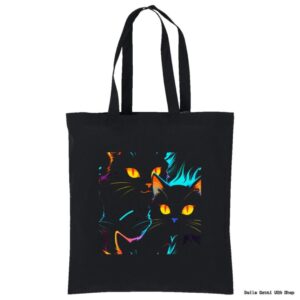 A black tote bag featuring a vibrant, neon-style illustration of two black cats with glowing yellow eyes and colorful outlines in blue, orange, and purple hues. The cats’ faces appear alert and expressive against the dark background.
