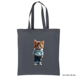 A gray tote bag features an illustration of an orange tabby kitten standing upright. The kitten is wearing a light blue hoodie, blue jeans, and sneakers, with its paws in its pockets, giving it a cool and casual appearance.
